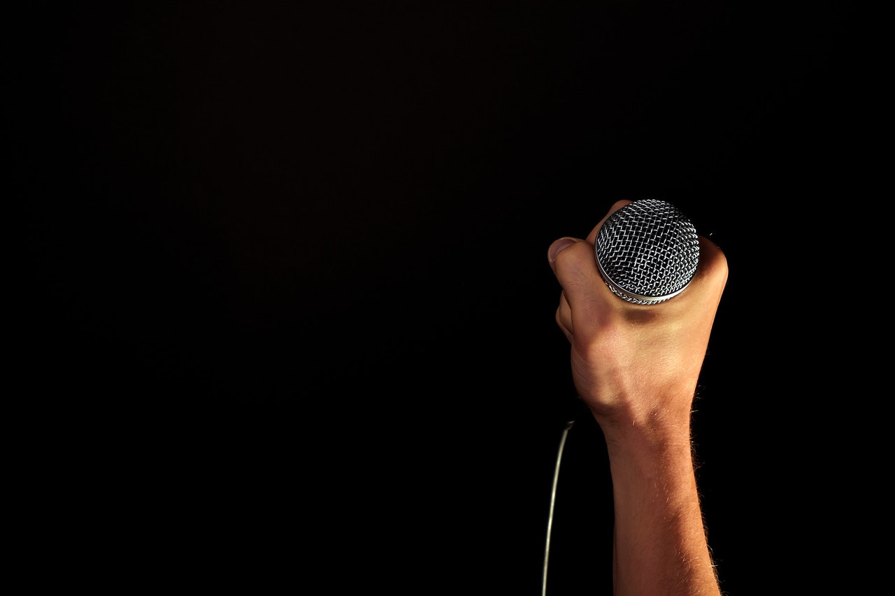 Why Do Singers Hold Their Microphone Weird?